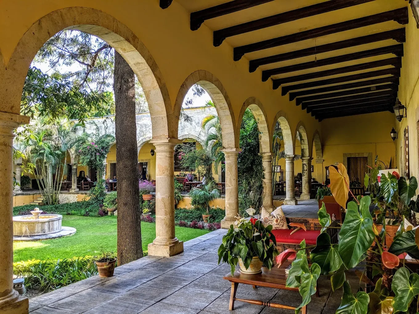 Arched corridor and garden at Hacienda Labor de Rivera