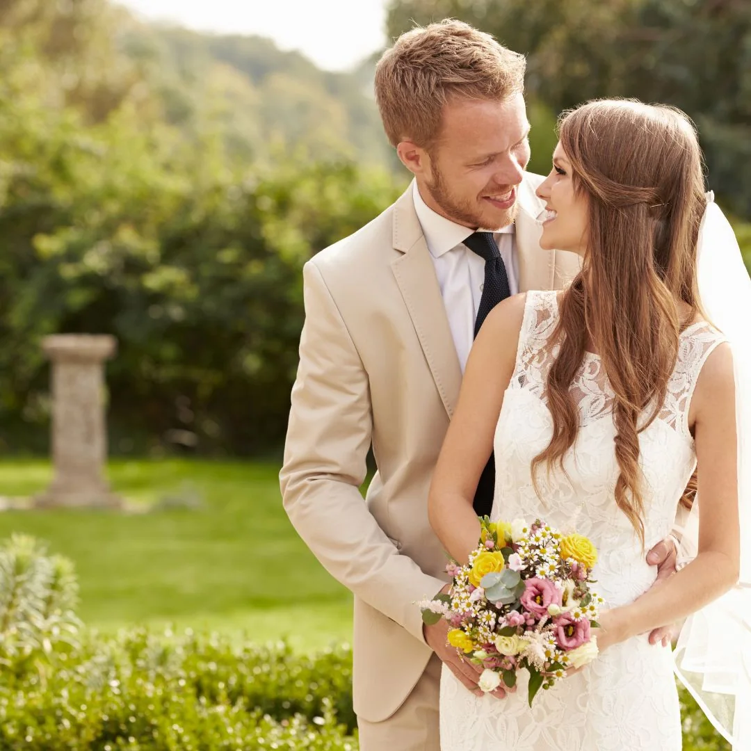 Bride and groom celebrating outdoors